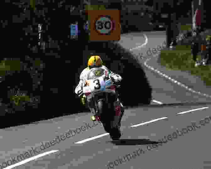 Joey Dunlop Conquering The Iconic Isle Of Man TT Course, Demonstrating His Exceptional Skill And Mastery Of The Treacherous Circuit Joey Dunlop A Tribute