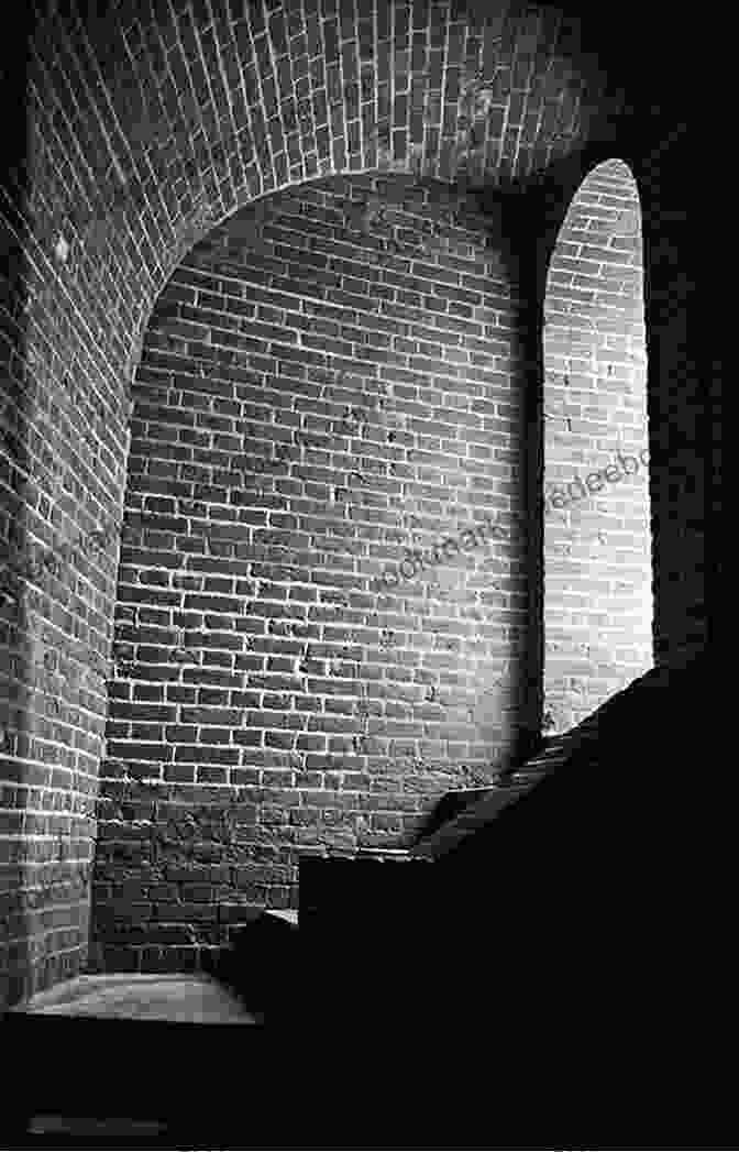 Photograph Of A Narrow, Dark Passageway With Brick Walls And A Wooden Door Nevermore Harold Schechter