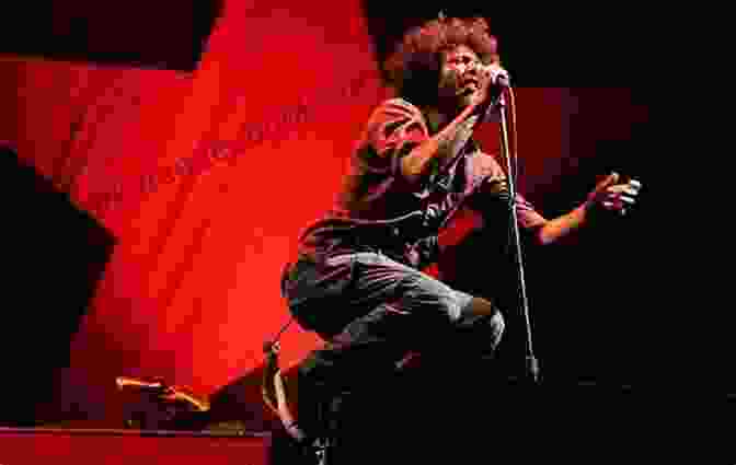 Rage Against The Machine Performing Live On Stage, With Zack De La Rocha In The Foreground, Tom Morello On The Left, Brad Wilk On The Drums, And Tim Commerford On The Bass. Rage Against The Machine Stage Fighters